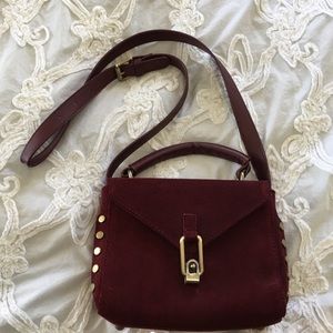 Reddish faux leather purse